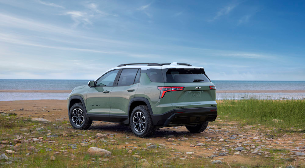 A green 2025 Chevy Equinox ACTIV is shown from the rear at an angle.