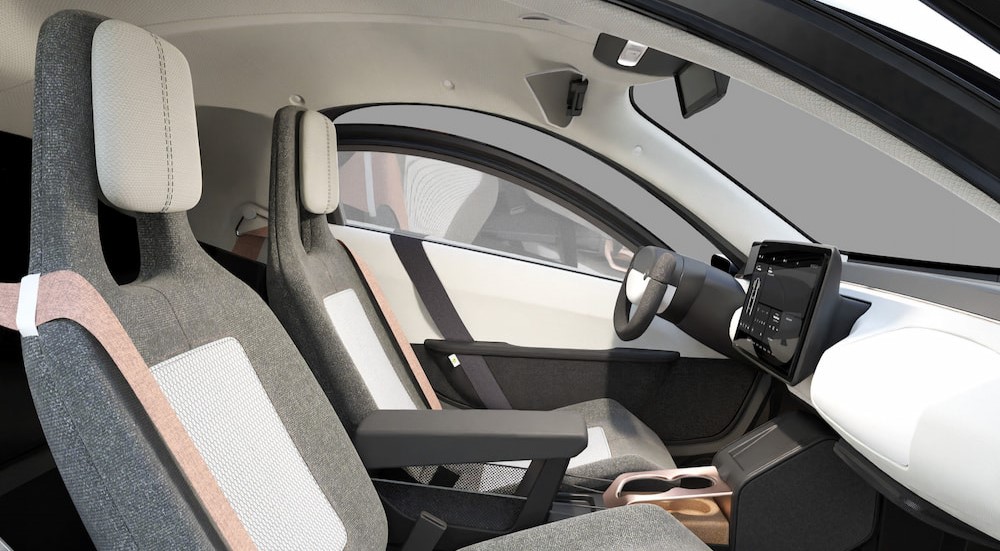 The white and gray interior and dash is shown in a Aptera Launch Edition.