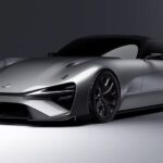 A silver Lexus Electrified Sport Concept is shown parked in a gray room.