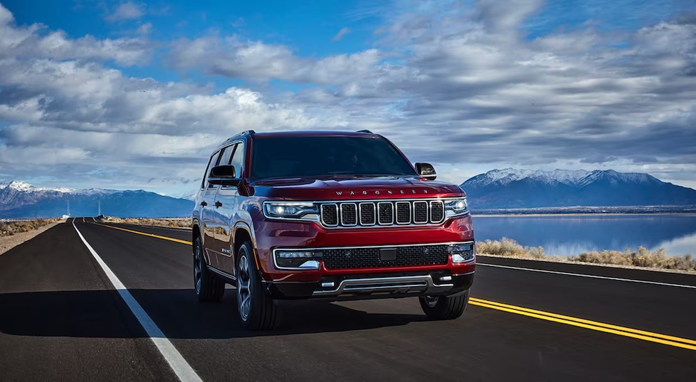 A red 2024 Jeep Wagoneer is shown from the front at an angle.