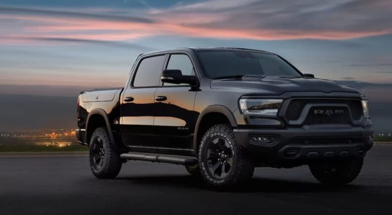 A black 2025 Ram 1500 Rebel angled right.