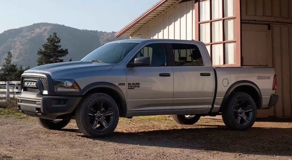 A white 2025 Ram 1500 Rebel Warlock parked off-road after visiting a Ram dealer.