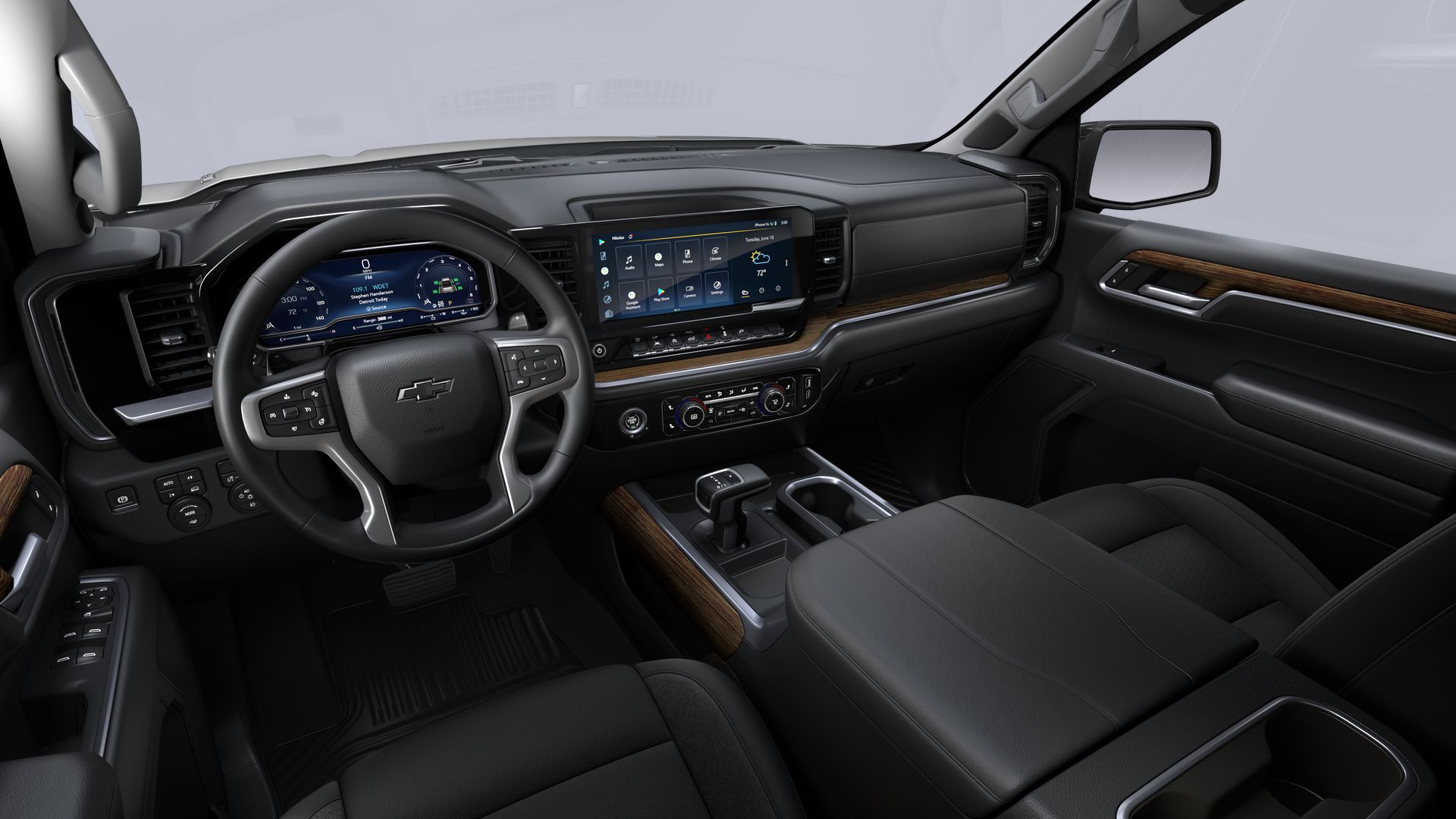 The black and brown interior and dash in a 2024 Chevy Silverado 1500 RST is shown.