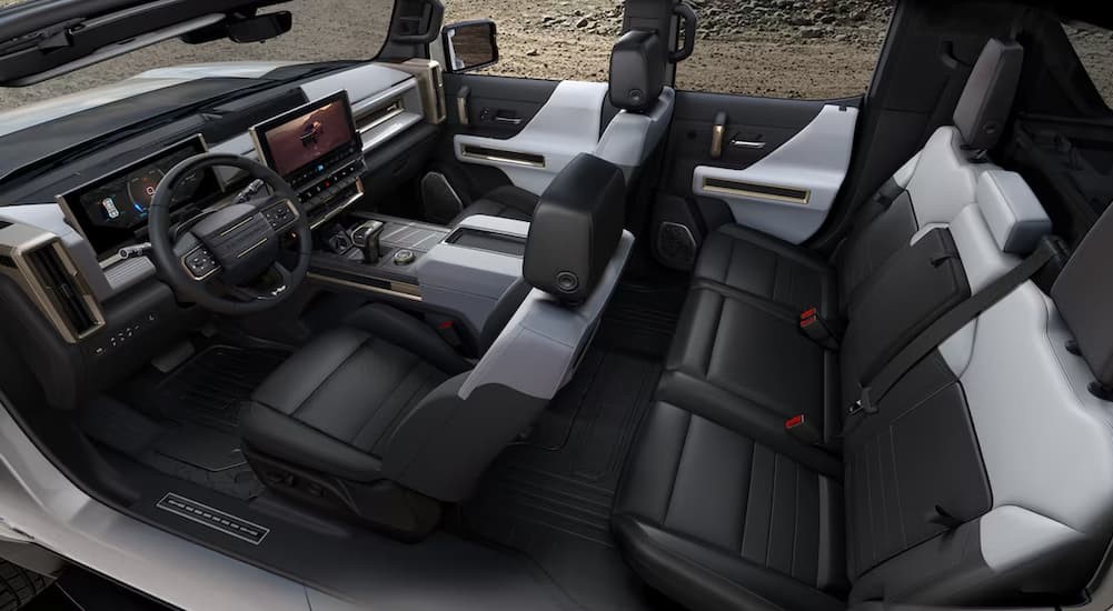 The black and white interior and dash in a 2024 GMC Hummer EV Pickup is shown.