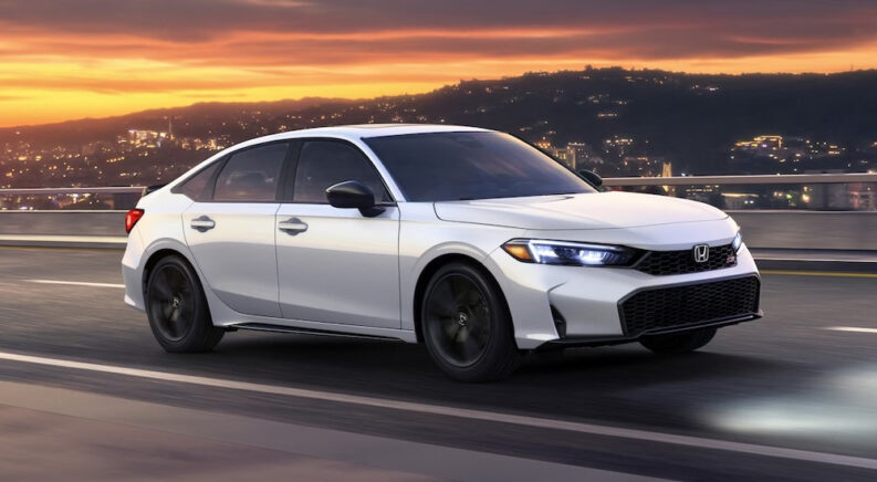 a white 2025 Honda Civic Si is shown from the side after leaving a Honda dealer.