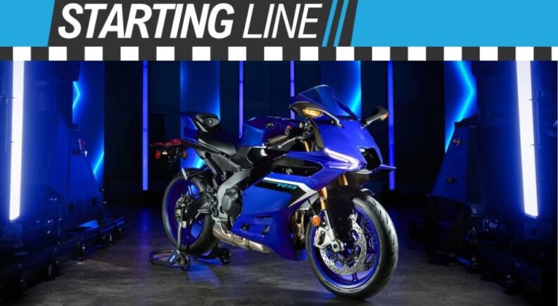 A blue 2025 Yamaha R9 is shown parked under the Starting Line banner.