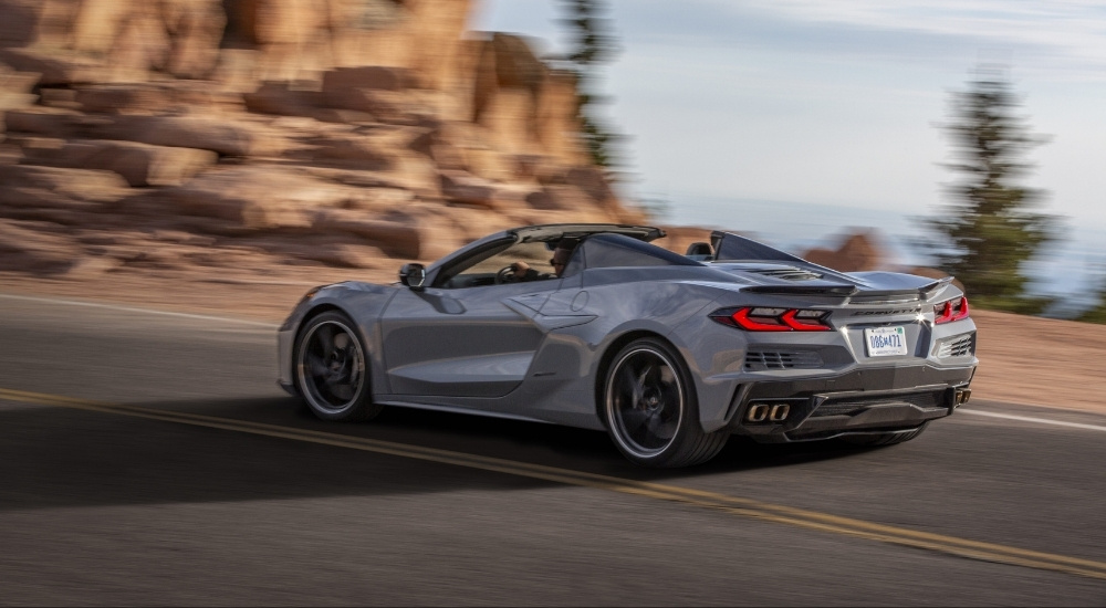 A grey 2024 Chevy Corvette E-Ray 3LZ is shown from the side.