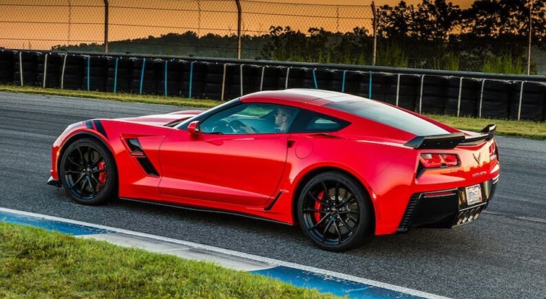 A red 2017 Chevy Corvette CT is shown parked after viewing a used Chevy for sale.