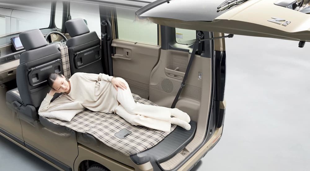 The interior is shown in a tan 2024 Honda N-Box.