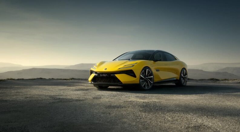 A yellow 2024 Lotus Emeya is shown parked on a sunny day.