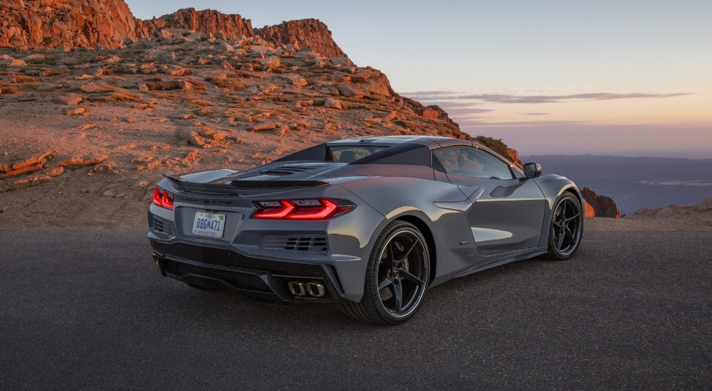 A grey 2025 Chevy Corvette E-Ray 3LZ is shown at an overlook.