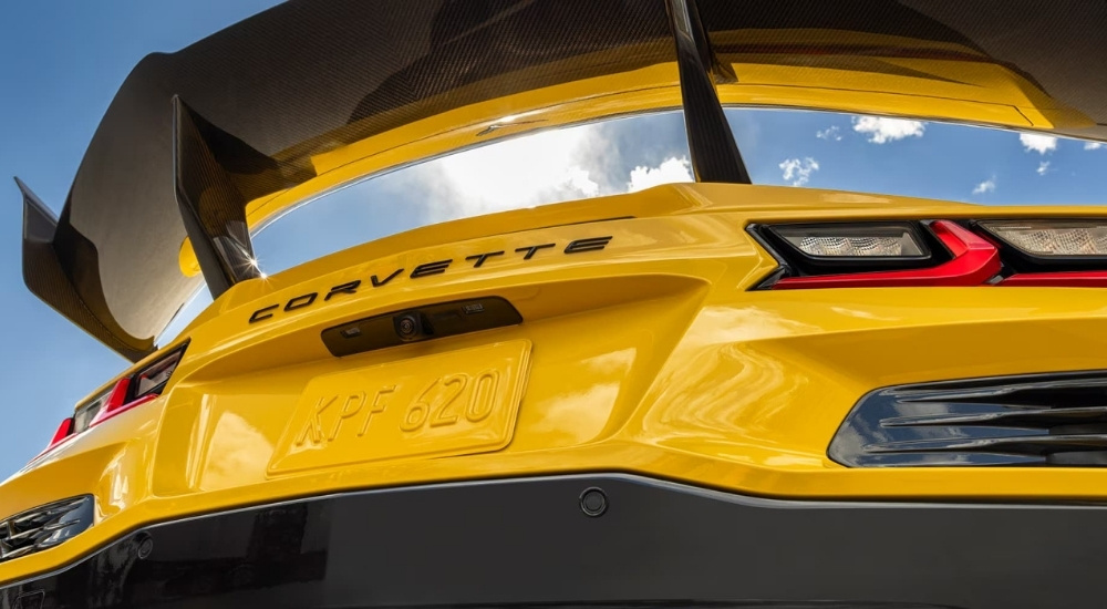 A close up shows the spoiler on a yellow 2025 Chevy Corvette ZR1. 