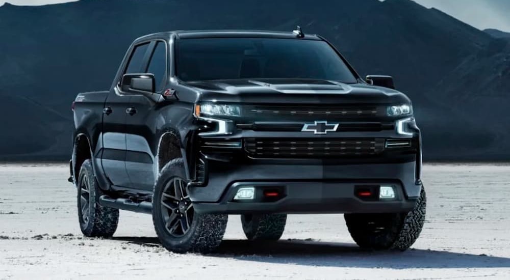 A black 2024 Chevy Silverado 1500 Z71 Midnight Edition is shown parked after viewing "used trucks for sale near me."