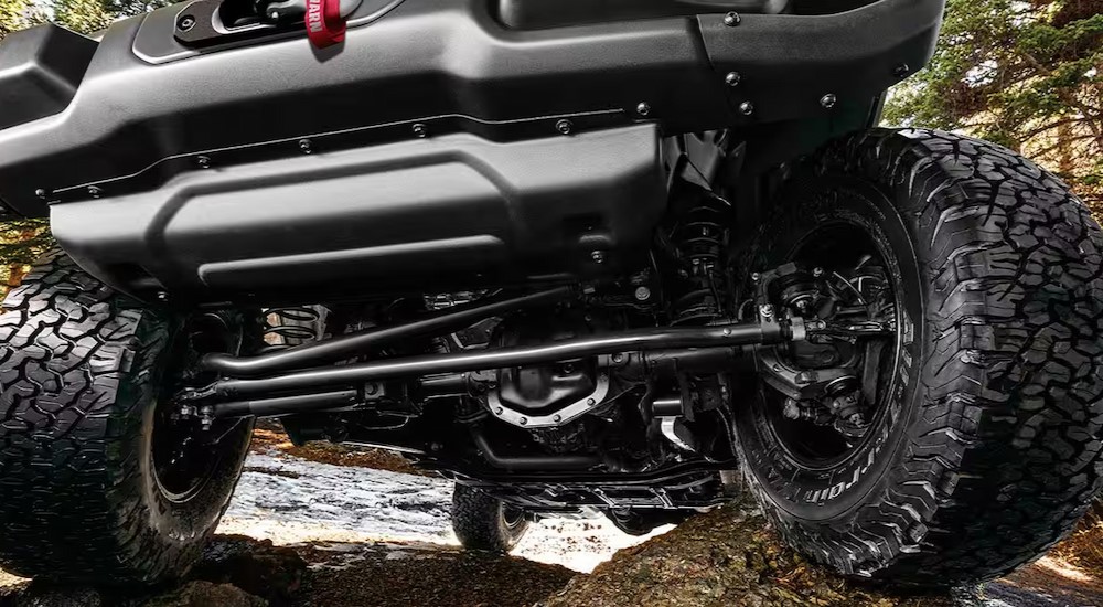 A close-up of the undercarriage is shown on a 2025 Jeep Wrangler.