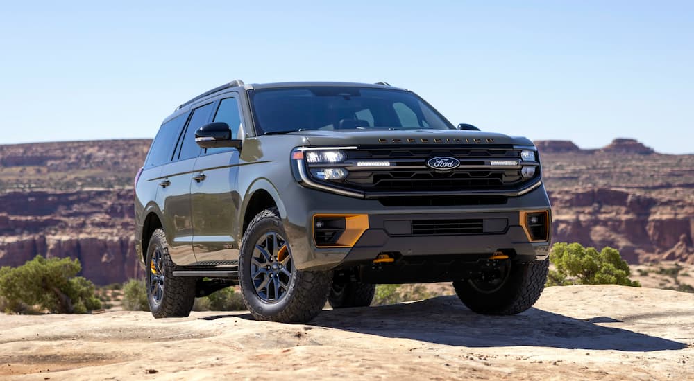 A green 2025 Ford Expedition Tremor parked off-road and angled right.