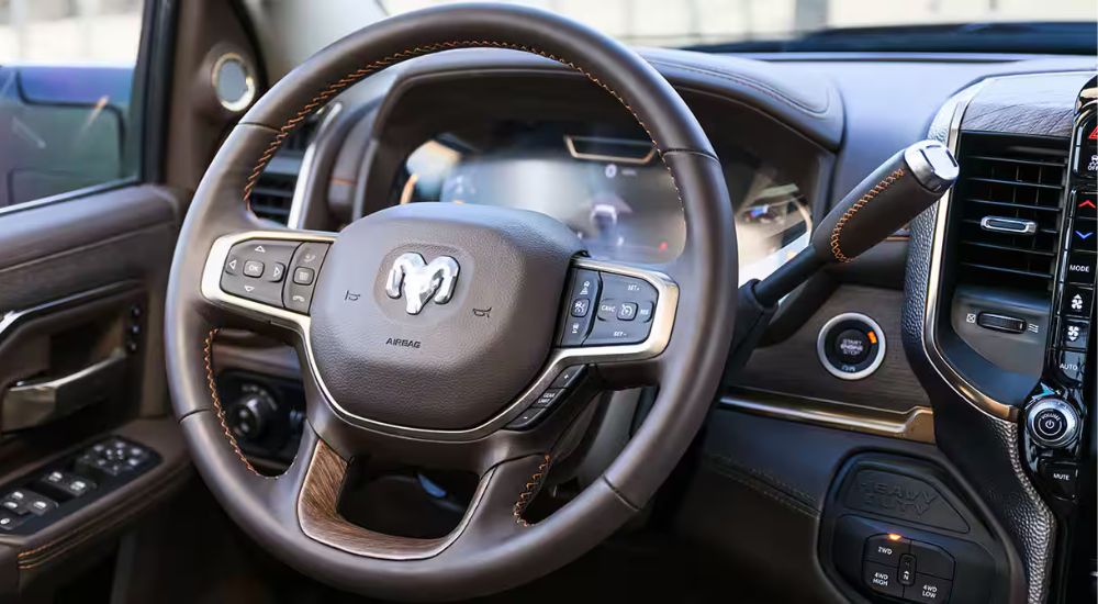 The steering wheel in a 2025 Ram 3500 Limited Longhorn at a Ram dealer.