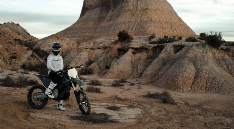 A black 2024 Stark Varg MX is shown parked off-road.