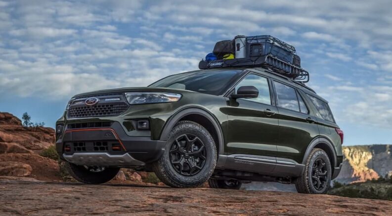 A green 2021 Ford Explorer Timberlane Edition is shown parked after viewing a used Ford Explorer for sale.