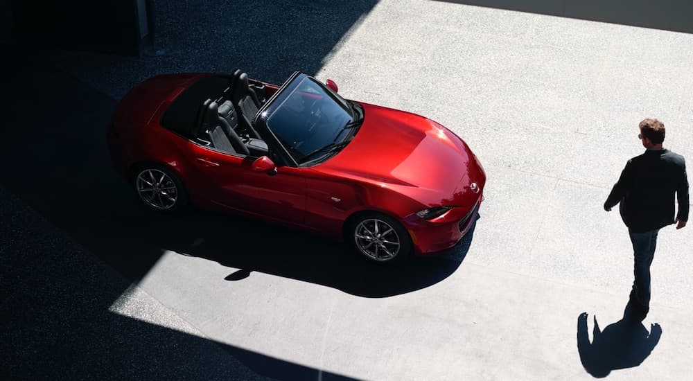 A red 2025 Mazda Miata from a high angle.