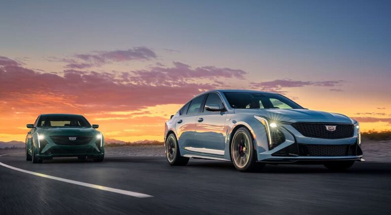 Green and blue 2025 Cadillac V Series driving on highway