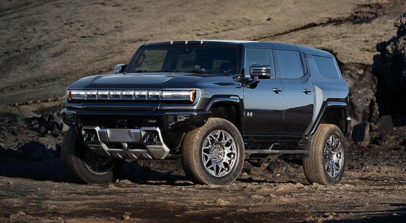 Black 2025 Hummer EV parked off-road