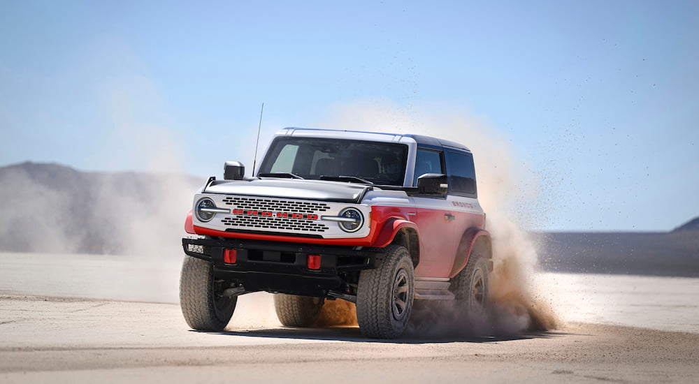 A white and red 2025 Ford Bronco Stroppe Edition driving through a desert.