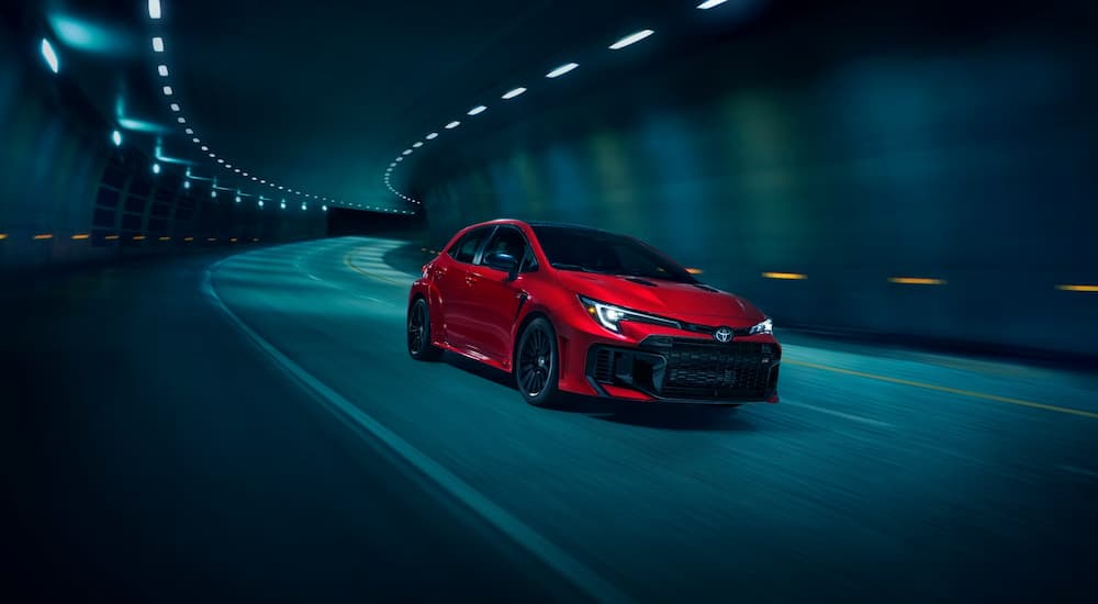 Red 2025 Toyota Corolla GR driving in a tunnel