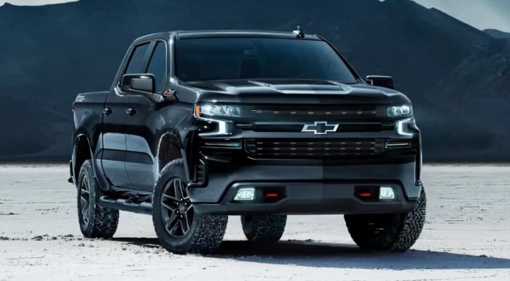 A black 2024 Chevy Silverado 1500 Z71 parked off-road.
