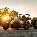 A black and red Ariel Atom parked