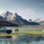 A blue BYD Yangwang U8 Premium Edition parked in a scenic area.