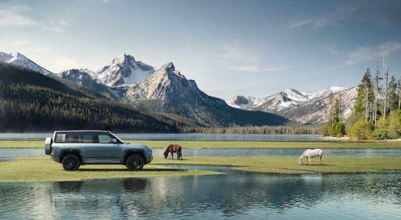 A blue BYD Yangwang U8 Premium Edition parked in a scenic area.