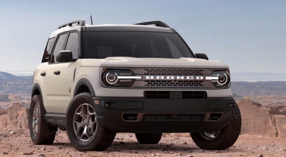 A white 2024 Ford Bronco Sport Badlands parked off-road.
