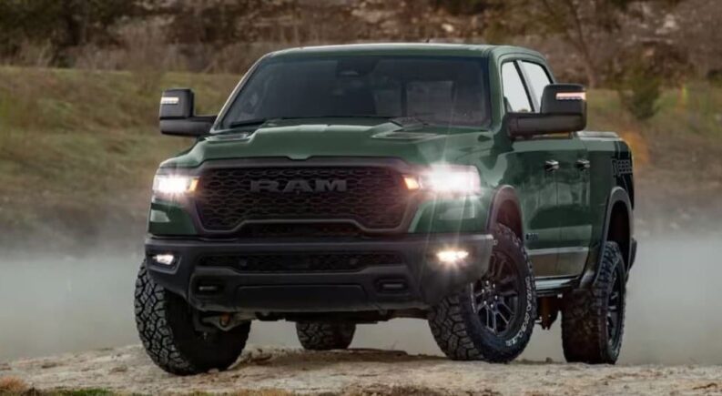 A green 2026 Ram 1500 Rebel parked off-road.