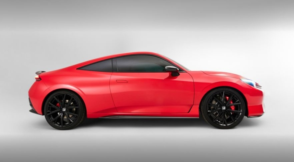 Side view of a red 2026 Honda Prelude
