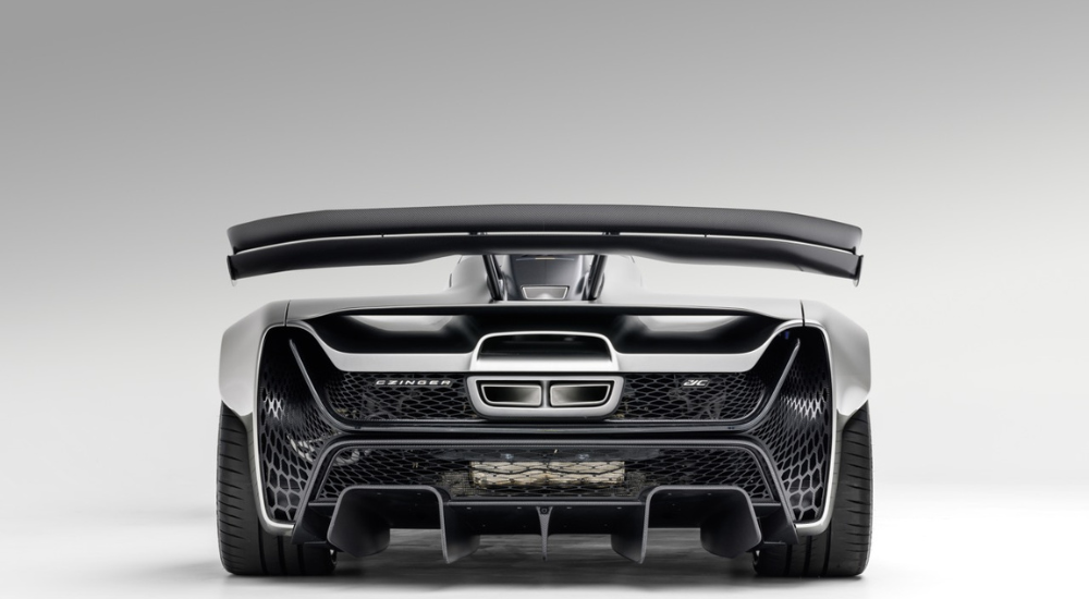 Silver Czinger 21C from the rear at a low angle.