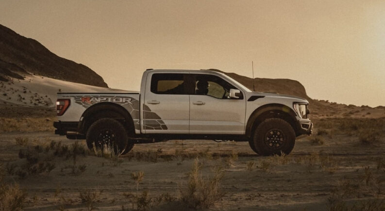 White 2023 Ford F-150 Raptor R parked off-road