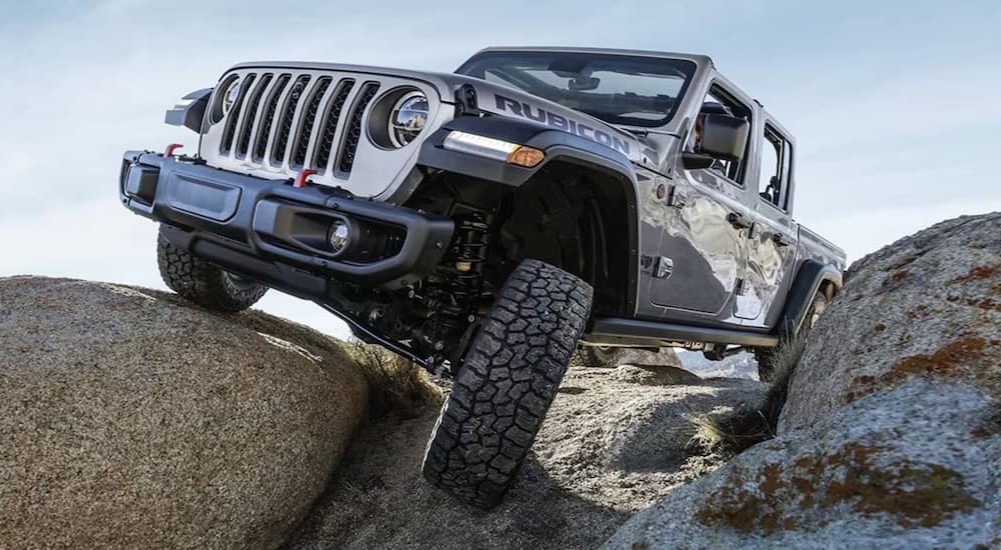 A silver 2022 Jeep Gladiator off-roading.