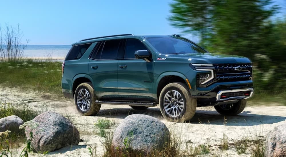 A green 2025 Chevy Tahoe Z71 for sale off-road.