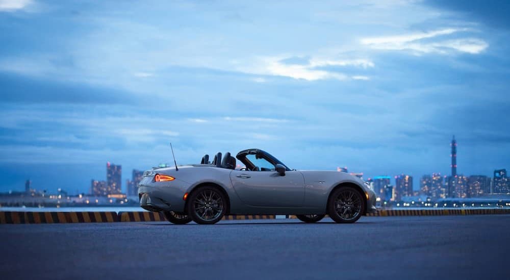 A silver 2025 Mazda MX-5 Miata parked outdoors.
