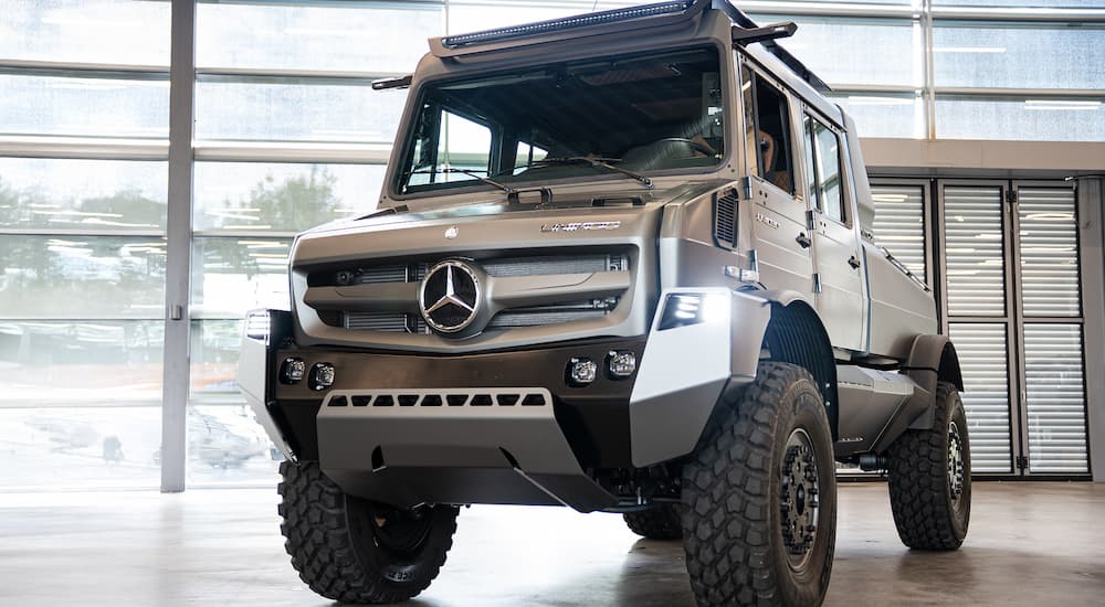 A silver 2026 Mercedes-Benz Unimog parked in a showroom