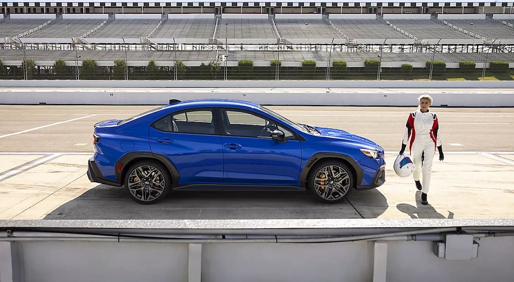 Blue 2026 Subaru WRX on the racetrack with driver