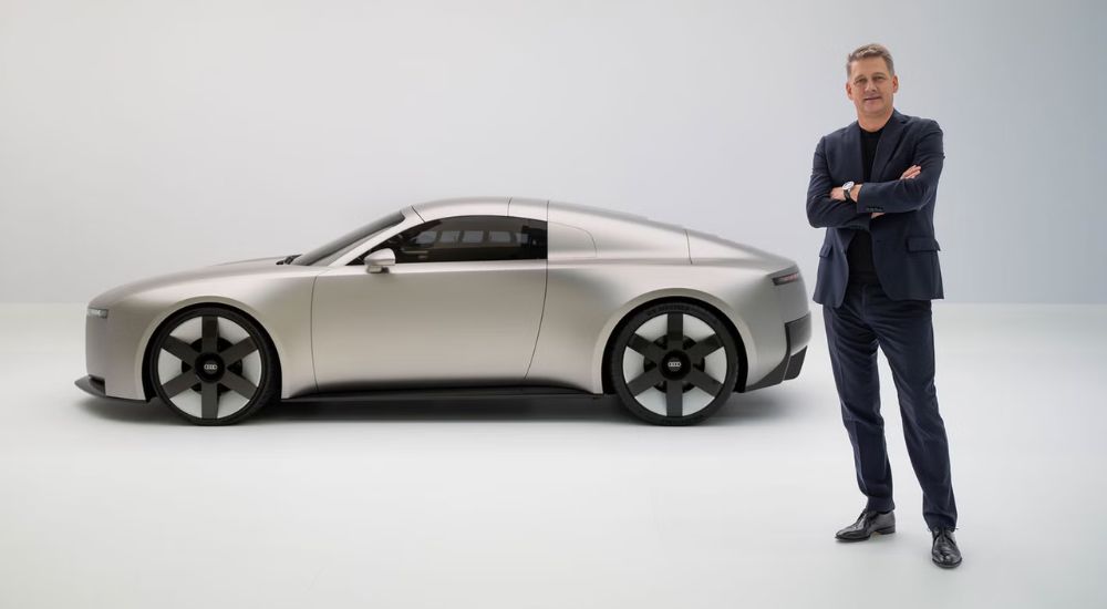 Silver 2026 Audi Concept C EV with Audi CEO Gernot Döllner