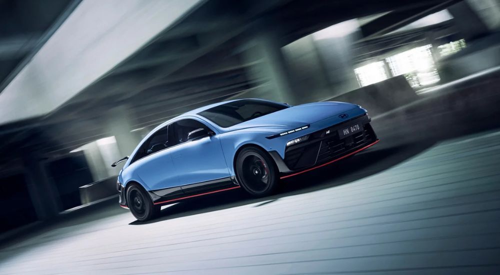 Blue 2026 Hyundai IONIQ 6 N driving through a parking garage.