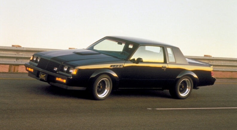 Black 1987 Buick Grand National GNX driving.