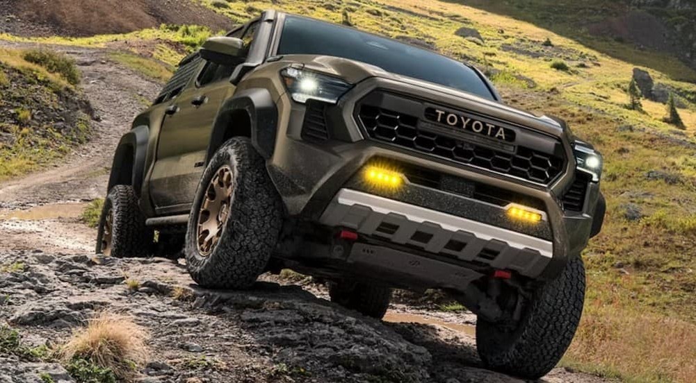 A green 2026 Toyota Tacoma off-roading.