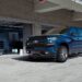 A blue 2019 Chevy Silverado 1500 parked near a used Chevy for sale.