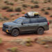 A green 2025 Ford Expedition for sale is driving off-road.