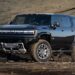 Black 2025 Hummer EV parked off-road