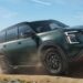 A green 2025 Nissan Armada driving off-road