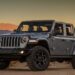 A gray 2021 Jeep Wrangler Willys parked offroad.